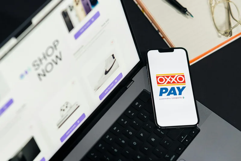 Indonesian mobile phone showing e-wallet payment options including OVO, DANA, ShopeePay, and QRIS scan to pay at an ecommerce checkout screen