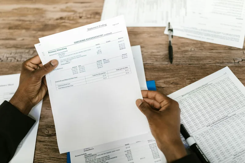 Indonesian ecommerce seller reviewing BNPL transaction data and settlement reports on a desktop with Rupiah conversion metrics visible
