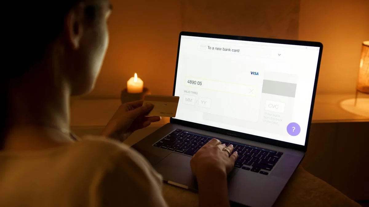Midtrans payment gateway dashboard on a laptop showing Indonesian ecommerce transactions and Rupiah amounts