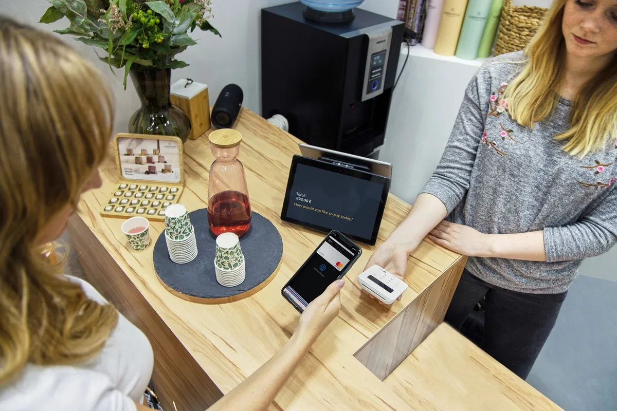 Contactless payment being completed at a retail terminal, representing Singapore ecommerce checkout