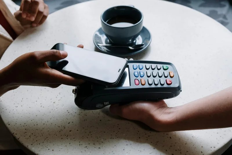 Smartphone tap-to-pay contactless payment at a point of sale terminal